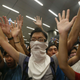 Protesters chant slogans in front of the police during a confrontation after a rally for the October 1 "Occupy Central" civil disobedience movement in Hong Kong September 27, 2014. Over 100 pro-democracy students stormed Hong Kong government headquarters and scuffled with police late on Friday in protest against the Chinese government's tightening grip on the former British colony
